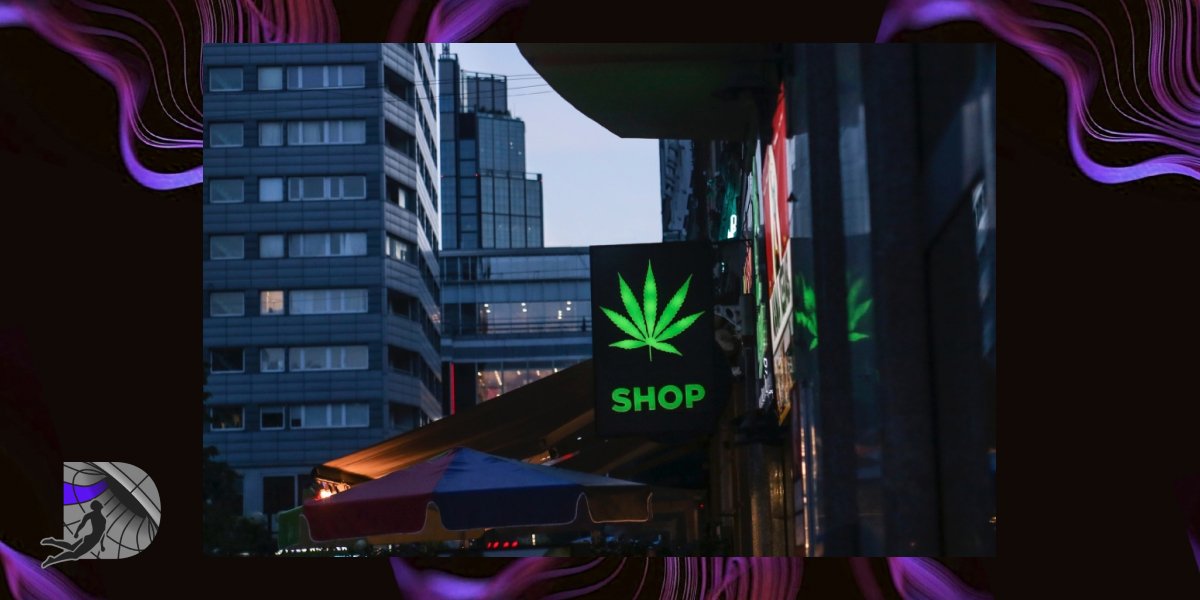 A neon green cannabis leaf sign with the word SHOP on a Brooklyn street.